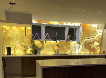 Custom size acrylic light panel illuminating a translucent onyx stone slab evenly, edge to edge