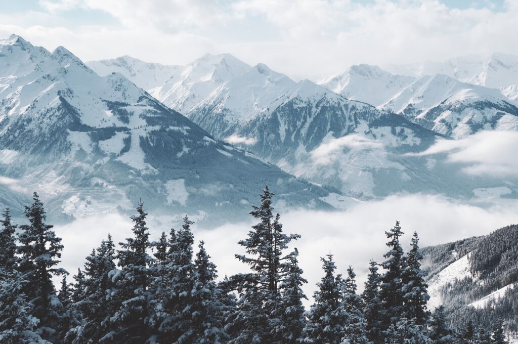 A beautiful shot of mountains and trees covered in snow and fog, for a Faux Window
